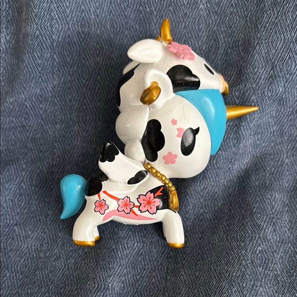 Cute Unicorn Figurine with Cow Print and floral design